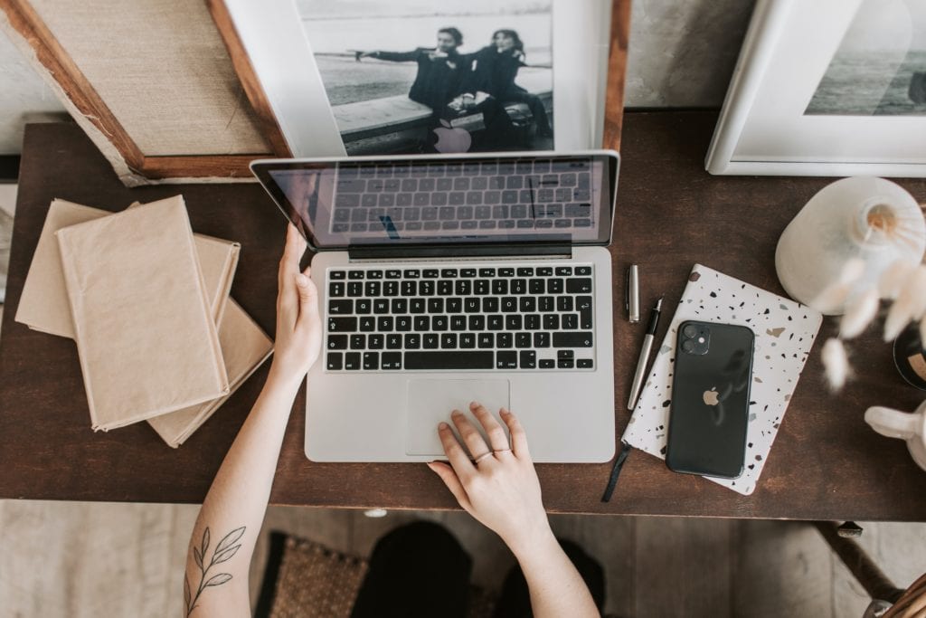Keywords: woman, laptop, wooden desk