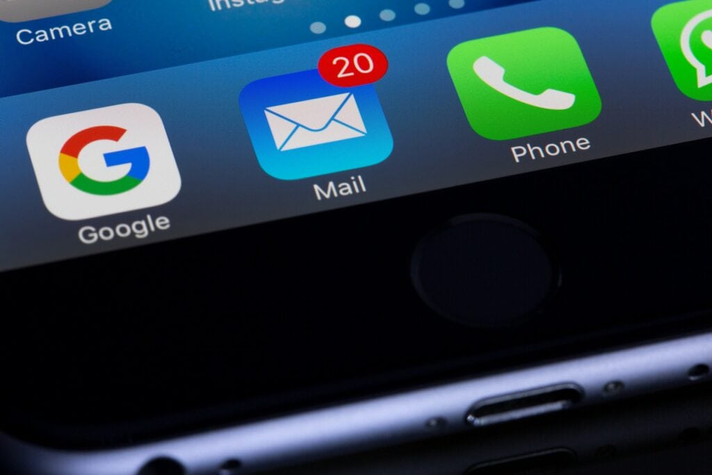 An iPhone displaying icons, complying with CAN SPAM Act – U.S. Anti Spam Laws.
